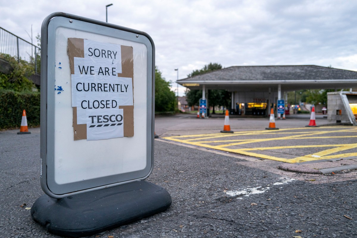 A Tesco petrol station with a sign that reads "sorry we are currently closed". The station is closed due to the fuel shortage in the UK currently