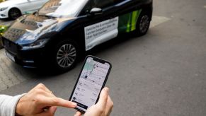 A customer ordering an Uber on their phone in Berlin, Germany