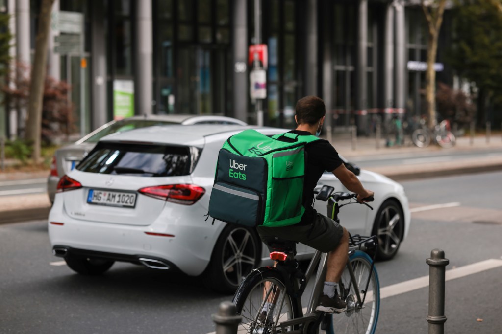  An Uber Eats delivery person rides a bicycle on August 20, 2021, in Frankfurt, Germany.