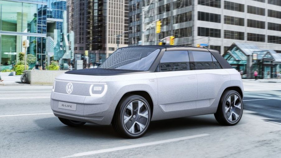 A grey Volkswagen ID.Life concept electric mini-suv parked in a city street