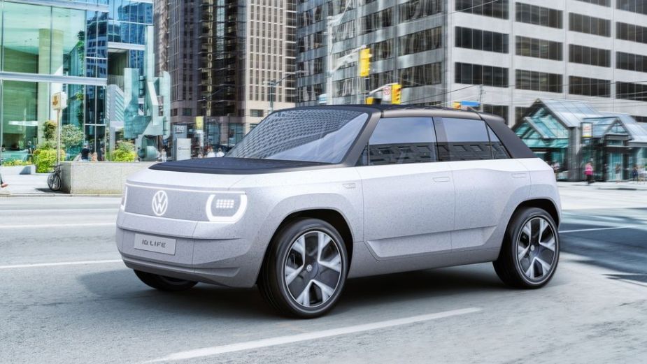 A grey Volkswagen ID.Life concept electric mini-suv parked in a city street