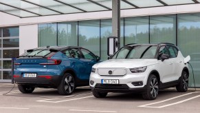 The all-electric Volvo C40 (left) and Volvo XC40 Recharge at a charging station