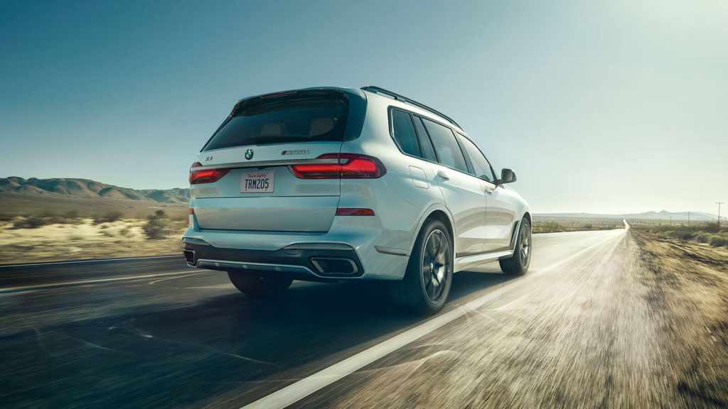 White 2022 BMW X7 driving on a desert highway