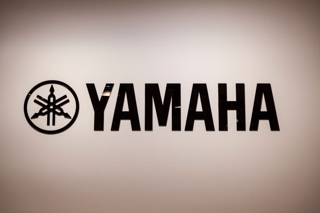 Black Yamaha logo against a cream background.