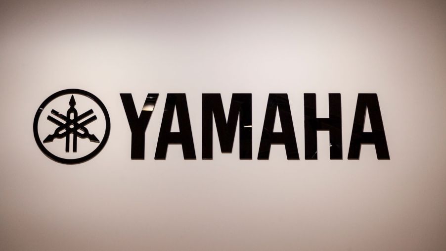 Black Yamaha logo against a cream background.