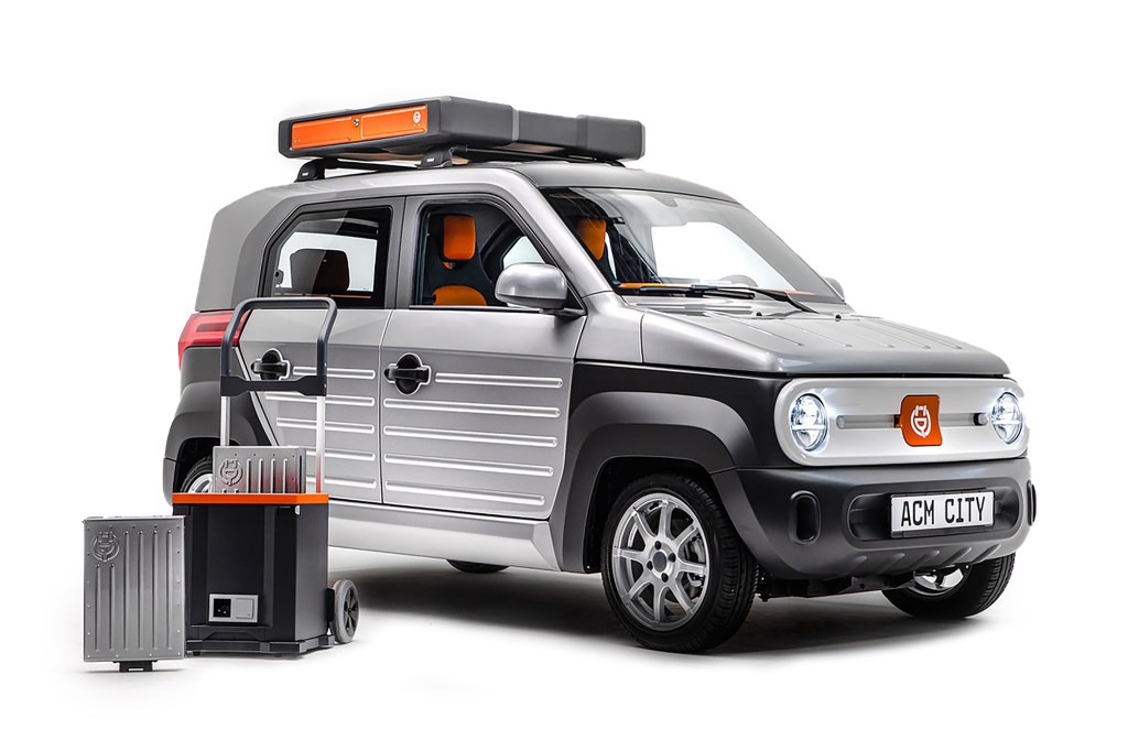 The black and silver City One EV, shown with batteries in its matching cart