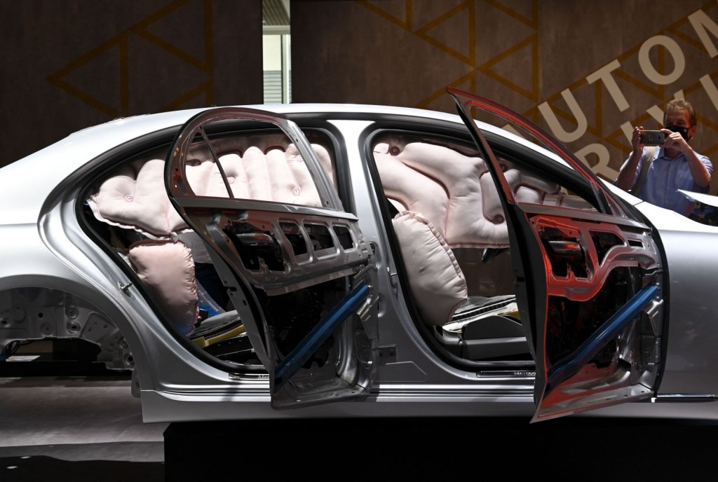 An airbag functionality safety test done on a Mercedes-Benz vehicle frame