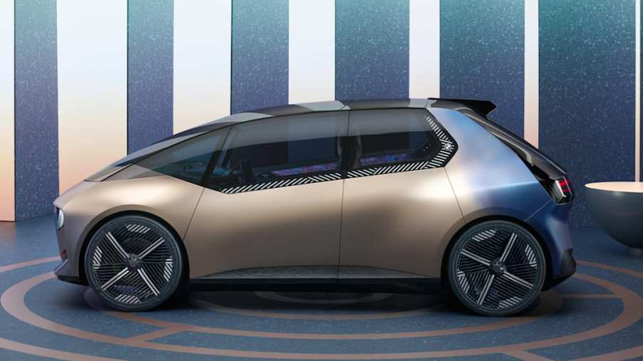 A BMW iVision Circular concept, rendered on a showroom floor