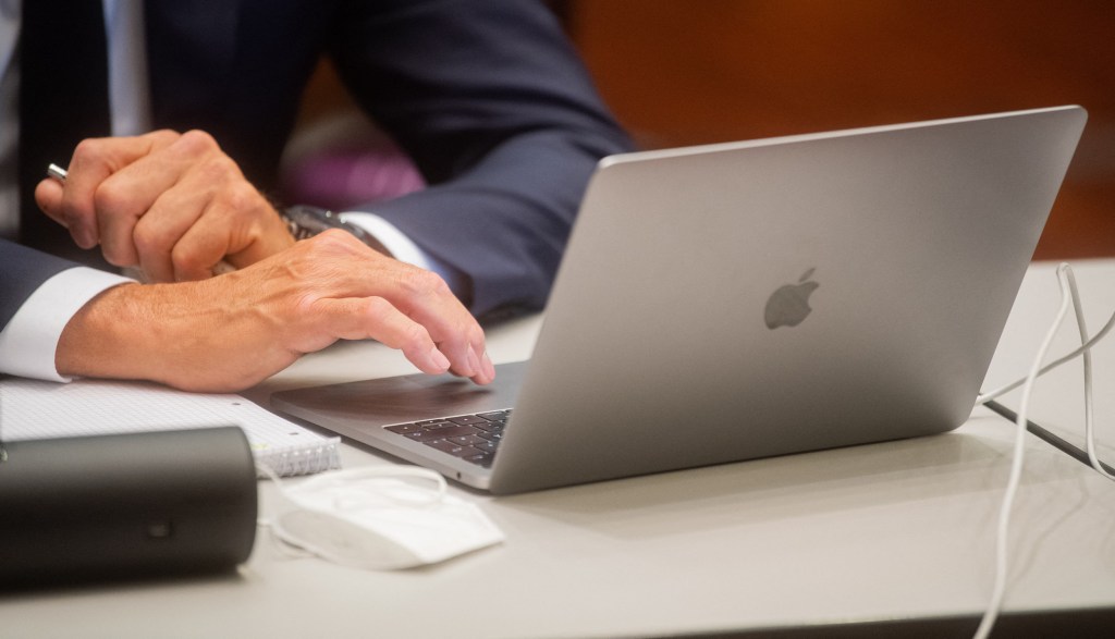 One of four former Volkswagen (VW) executives uses his laptop