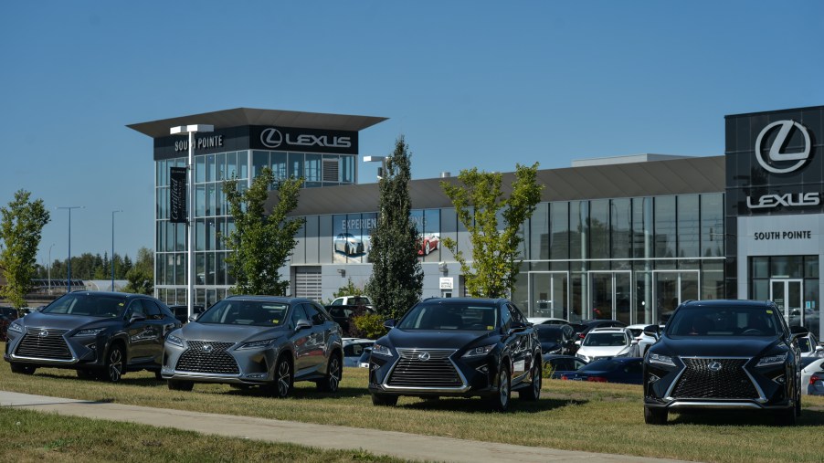 New Lexus vehicles parked outside a Lexus dealership