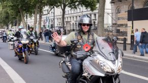 A group of motorcyclists riding their motorcycles on a highway.