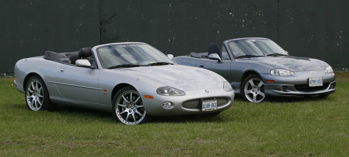 The Mazda Miata MX-5 and Jaguar XKR parked outside