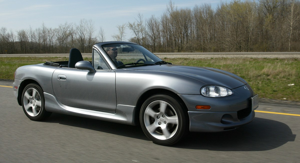 Mazda MX-5 Miata NB driving on the street