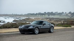 A black BMW Z8 coupe built by Smit Vehicle Engineering shot on a beach from the front 3/4 angle