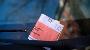 A parking ticket on the windshield of a vehicle in New York City