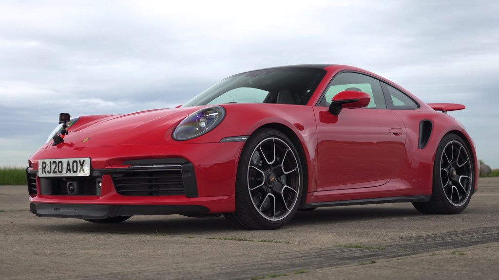 Red 2021 Porsche 911 Turbo S preparing for a drag race