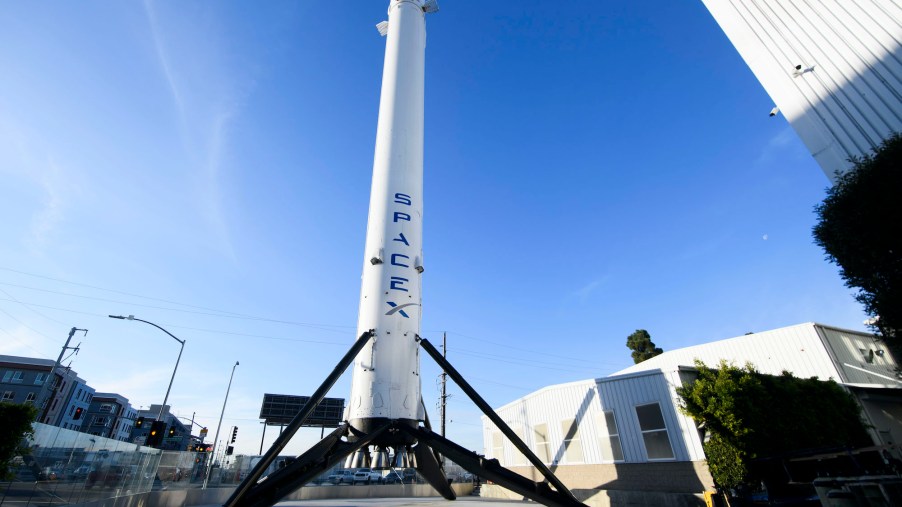 The recovered first stage of a Falcon 9 rocket stands at Space