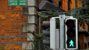 A traffic light with a green walk signal on Jones' Road near Croke Park Stadium in Dublin, Ireland