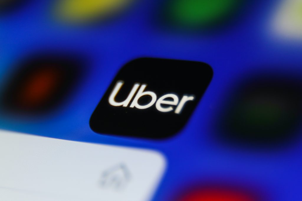 Uber icon is seen displayed on a phone screen in this illustration photo taken in Krakow, Poland on April 9, 2021