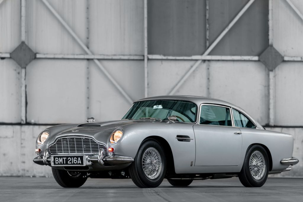 A silver 1964 Aston Martin DB5 Goldfinger Continuation in a warehouse