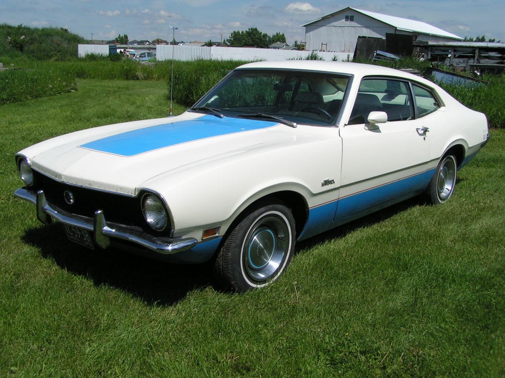 A white and blue 1972 Ford Maverick sedan