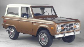 A brown-and-white 1974 Ford Bronco