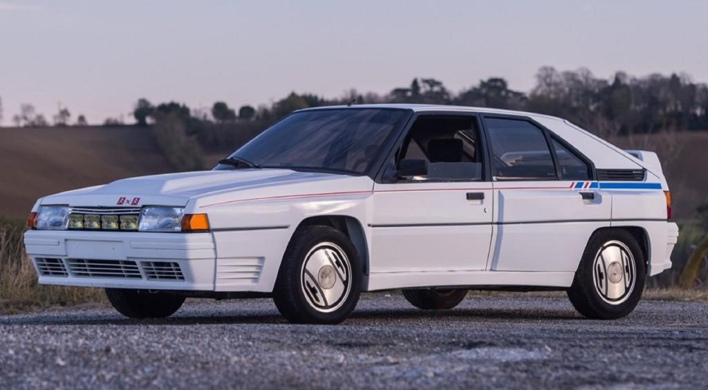 A white-with-blue-and-red-stripes 1986 Citroen BX 4TC Competition