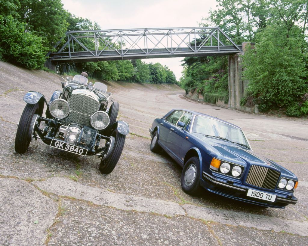 A dark-blue 1991 Bentley Turbo R next to a green 1930 Bentley 4.5-Litre 'Blower' at Brooklands