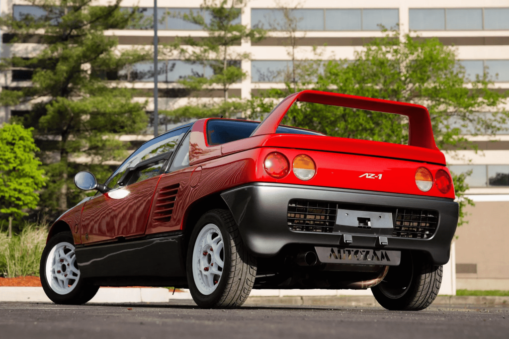 A red 1992 Autozam AZ-1 parked in left rear angle view of spoiler