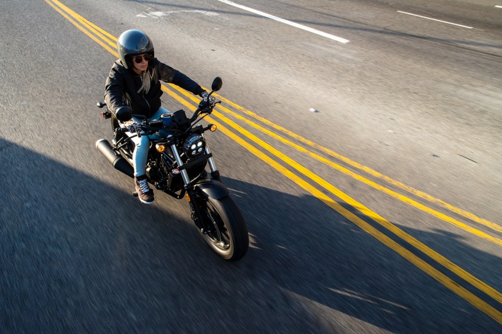 a rider on 2020 Honda Rebel riding through the street