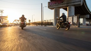 Riders riding a honda Rebel in to the sunset
