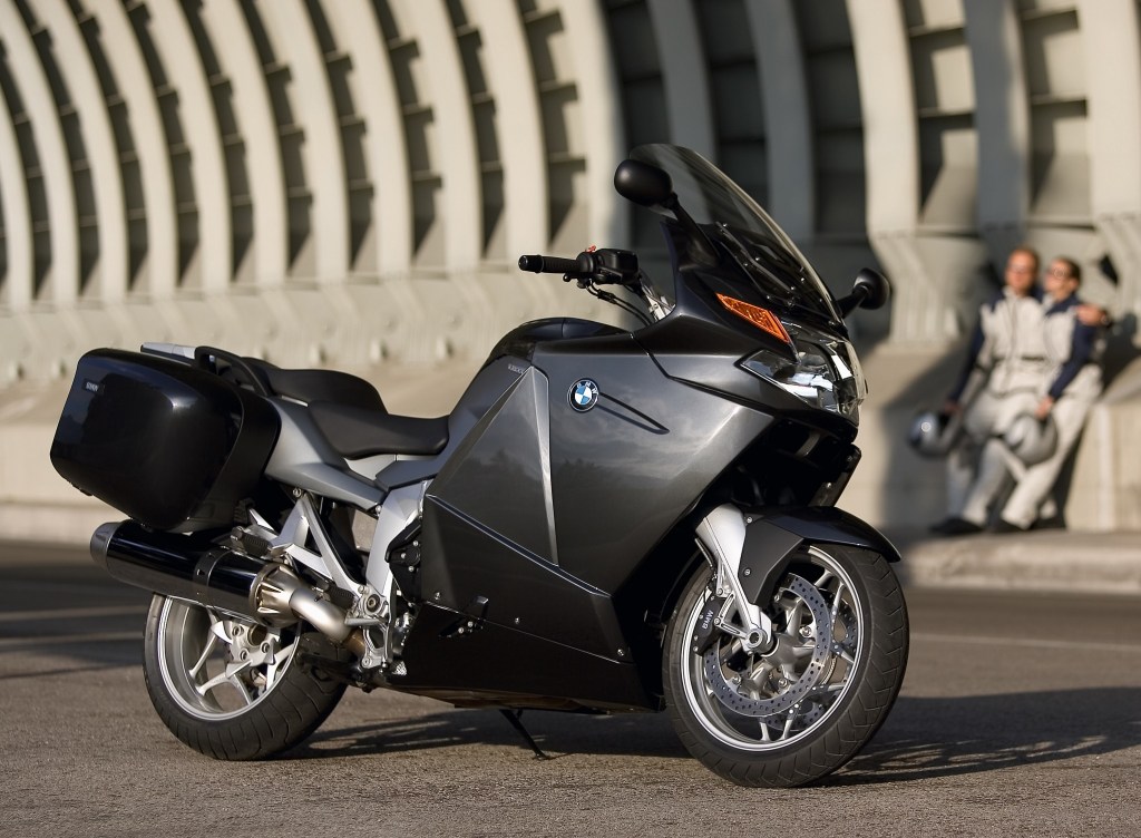 A gray-and-black 2006 BMW K 1200 GT next to a concrete structure