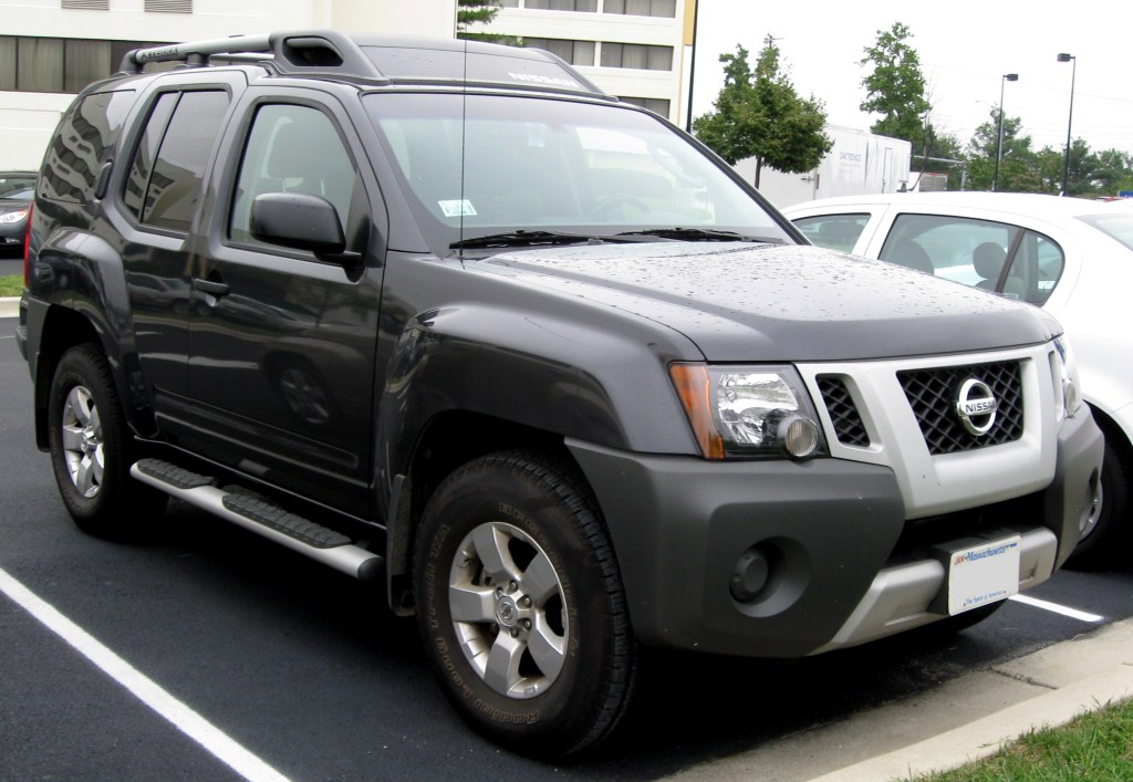 A discontinued black 2009 Nissan Xterra parked in a parking lot