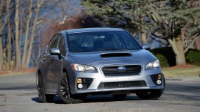 A silver Subaru WRX sedan, the perfect car for winter 2021, shot from the front on a winter day