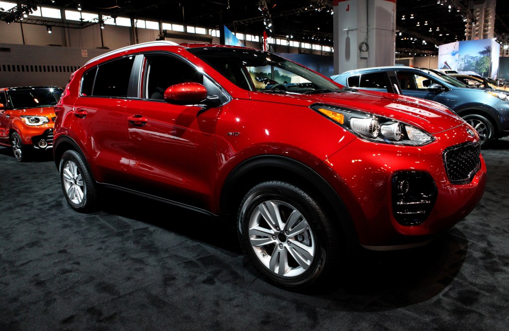 A red 2017 Kia Sportage parked at the Chicago Auto Show, it's one model year you should avoid.