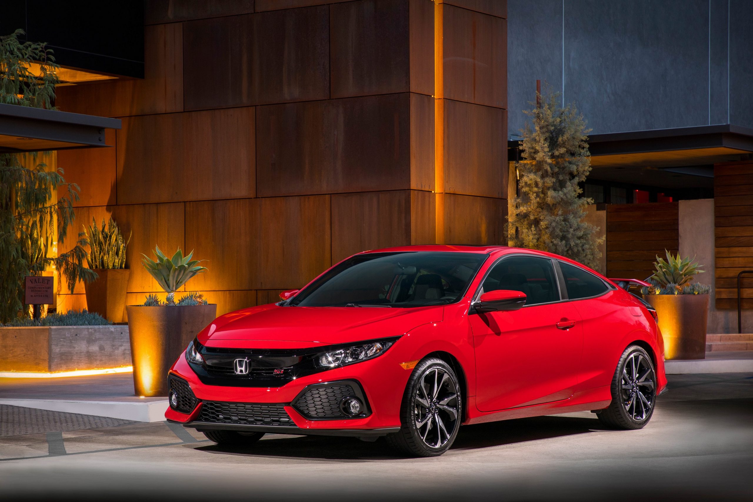 A red 2019 Civic Si shot from the front 3/4