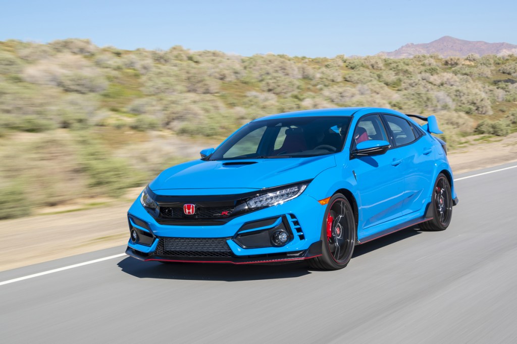 2020 Honda Civic Type R in Boost Blue driving down a road