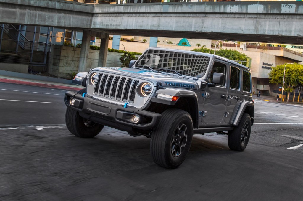 The 2021 Jeep Wrangler 4xe Rubicon driving in the city