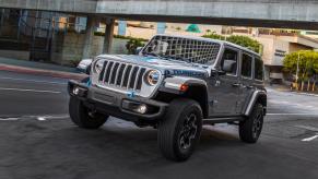 The 2021 Jeep Wrangler 4xe Rubicon driving in the city