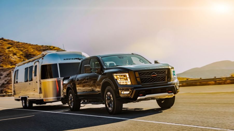 The 2021 Nissan Titan full-size pickup truck towing an Airstream trailer