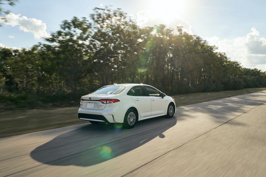 rear shot of the 2021 Toyota Corolla Hybrid driving down a highway