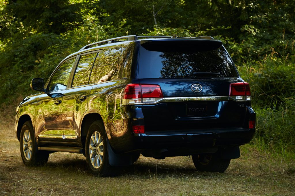 A rear shot of the 2021 Toyota Land Cruiser in the woods