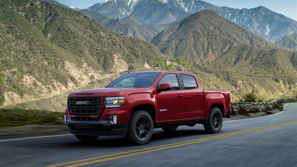 The 2021 GMC Canyon driving down the road 