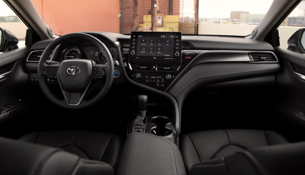 a black interior on the 2021 Toyota Camry Hybrid XSE