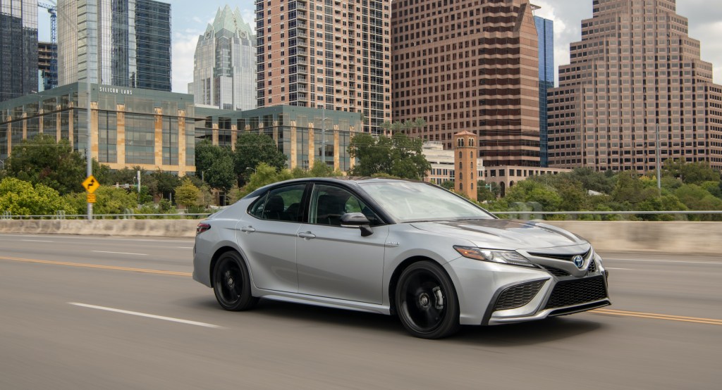 A side driving shot of the 2021 Toyota Camry Hybrid XSE for our full review
