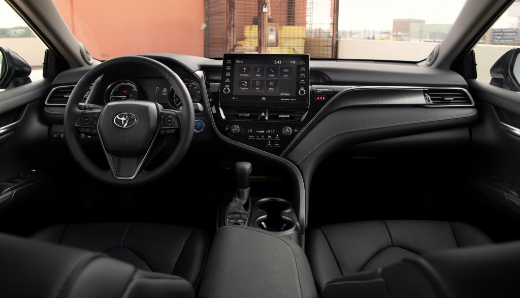 a picture of the front seat area in the 2021 Toyota Camry Hybrid XSE