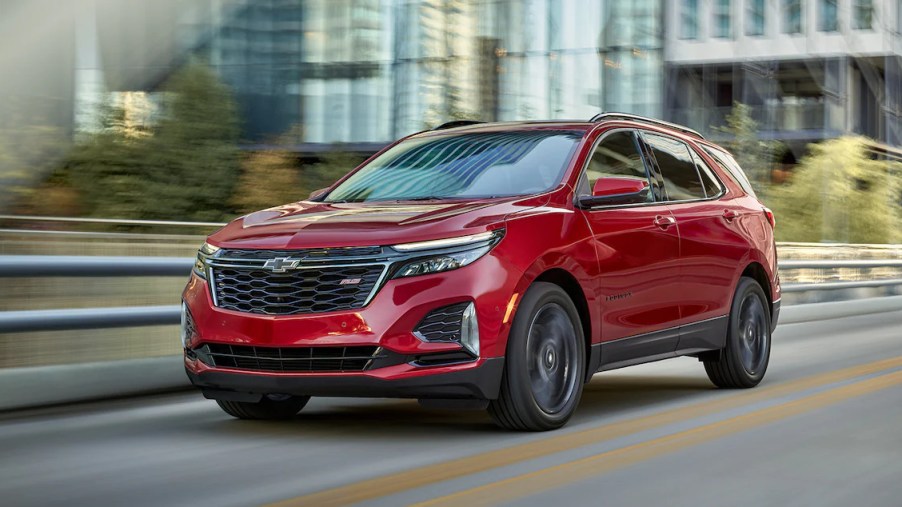 A red 2022 Chevrolet Equinox driving on the road