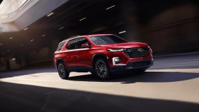 A red 2022 Chevy Traverse driving through a tunnel