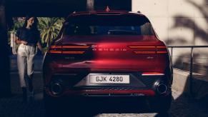 A red 2022 Genesis GV70 parked outside