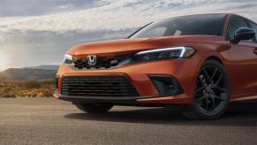 The front of an orange 2022 Honda Civic Si